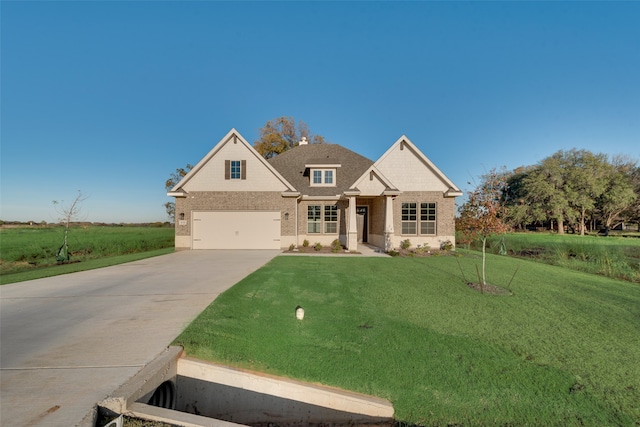 craftsman house with a garage and a front yard