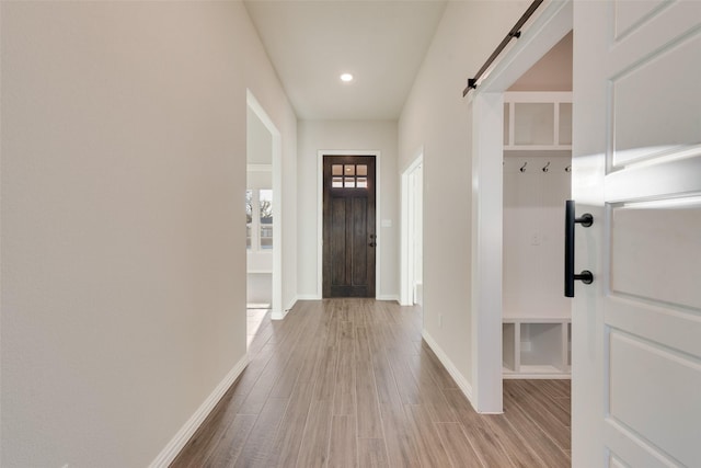 interior space featuring a barn door and light wood-type flooring