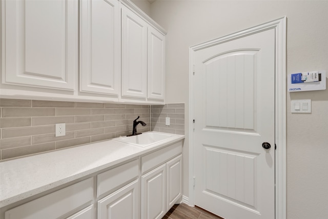 washroom with sink and dark wood-type flooring