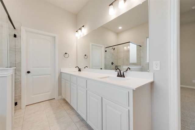 bathroom featuring vanity, an enclosed shower, and tile patterned floors