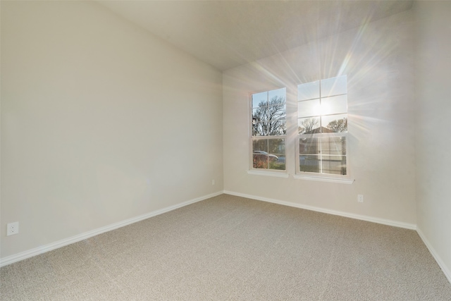 unfurnished room with carpet flooring