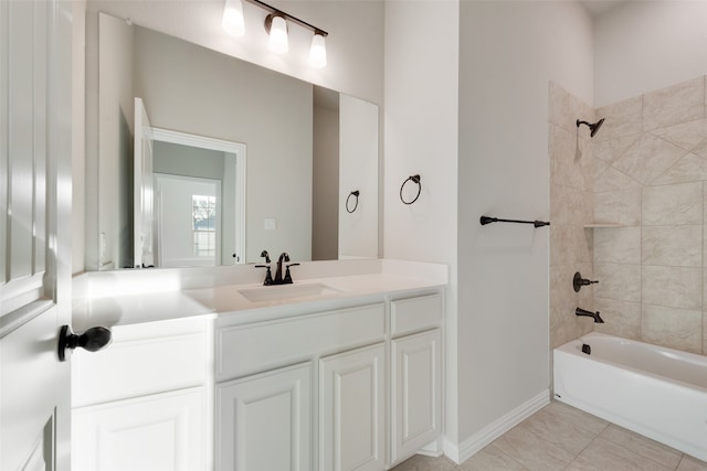 bathroom featuring vanity, tile patterned flooring, and tiled shower / bath combo