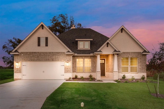 craftsman inspired home with a garage and a lawn