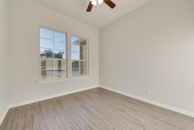 spare room with light hardwood / wood-style floors and ceiling fan