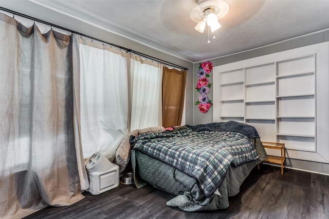 bedroom with dark wood-type flooring and ceiling fan