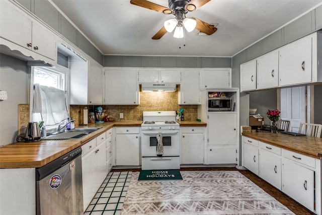 kitchen featuring stainless steel appliances, white cabinetry, sink, and backsplash