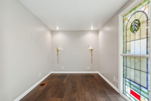 unfurnished room featuring dark hardwood / wood-style floors