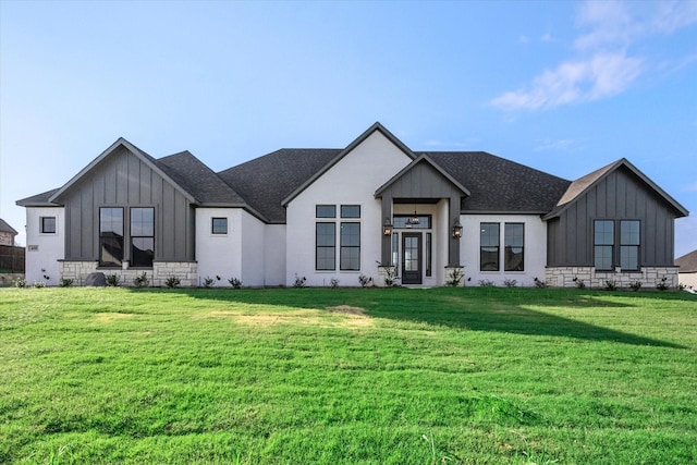 modern farmhouse style home with a front lawn