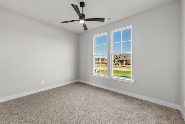 spare room with ceiling fan and carpet floors