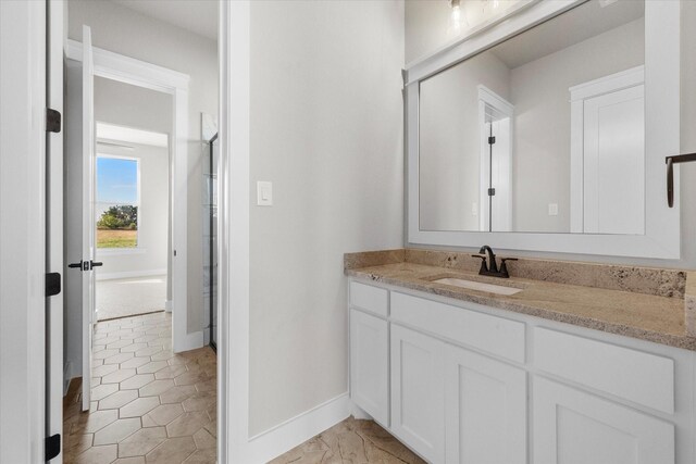 bathroom with tile patterned floors and vanity