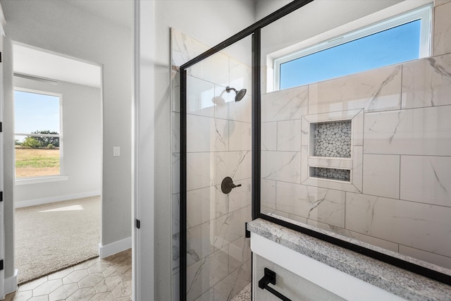 bathroom with tile patterned flooring and a shower with shower door