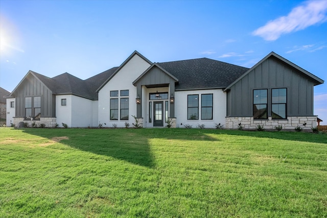 modern farmhouse with a front lawn