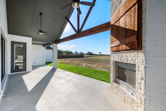 view of patio featuring ceiling fan