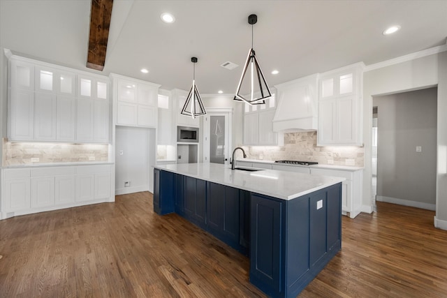 kitchen featuring custom exhaust hood, white cabinets, backsplash, and dark hardwood / wood-style floors