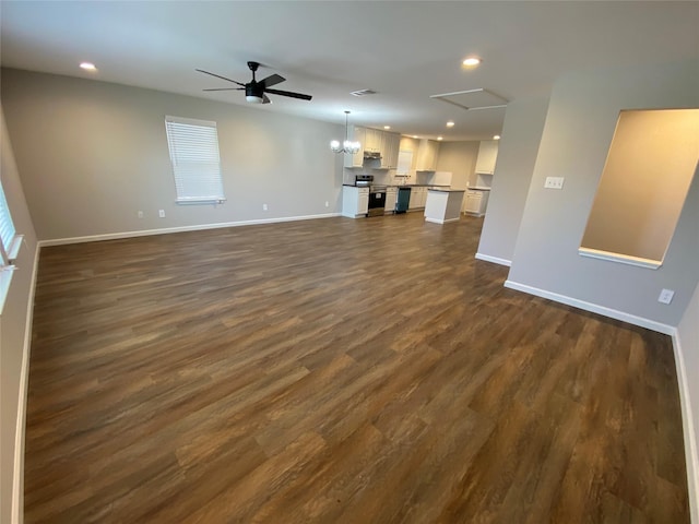 unfurnished living room featuring ceiling fan and dark hardwood / wood-style flooring