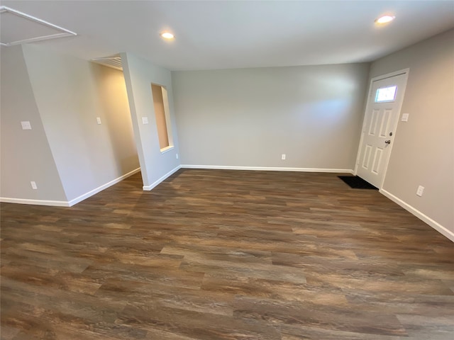 unfurnished room with dark hardwood / wood-style floors