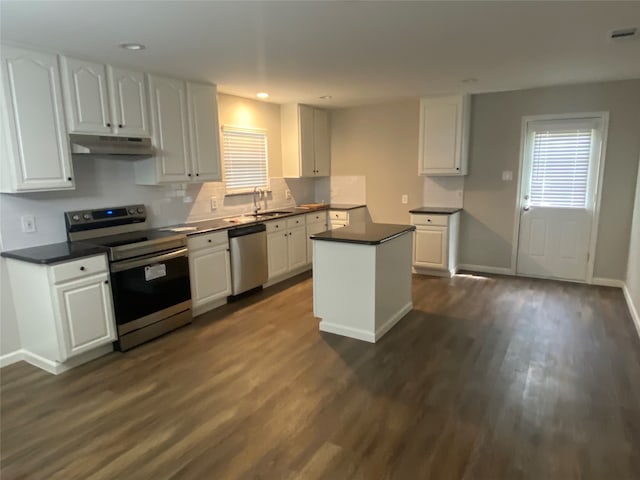 kitchen featuring white cabinets, stainless steel appliances, dark wood-type flooring, and sink