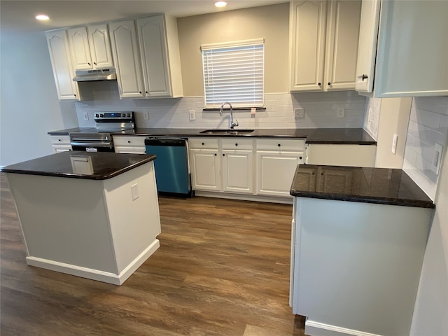 kitchen featuring stainless steel appliances, white cabinetry, and sink