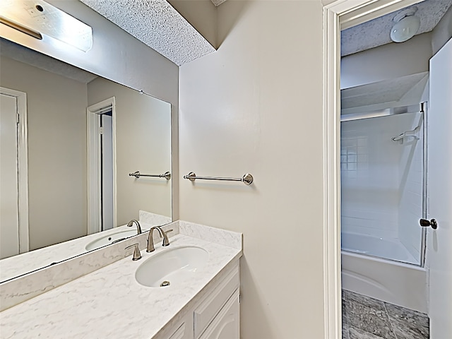 full bathroom with shower / bath combination with glass door and vanity