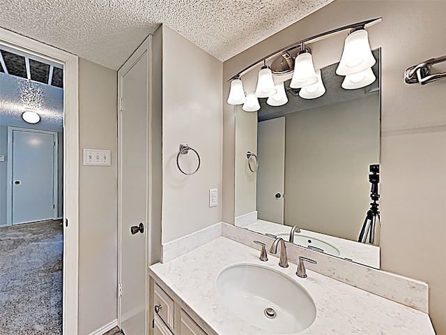 bathroom featuring vanity and a textured ceiling