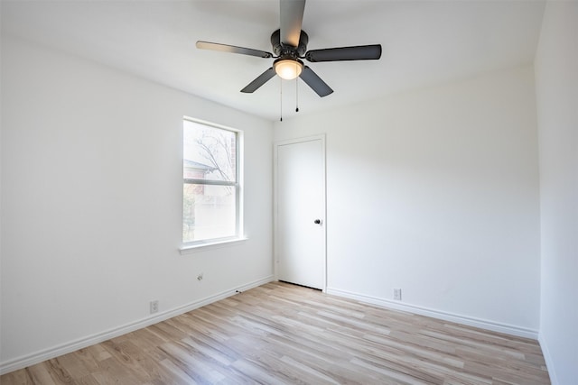 unfurnished room featuring ceiling fan and light wood-type flooring