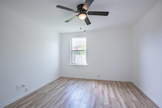 empty room with ceiling fan and light wood-type flooring