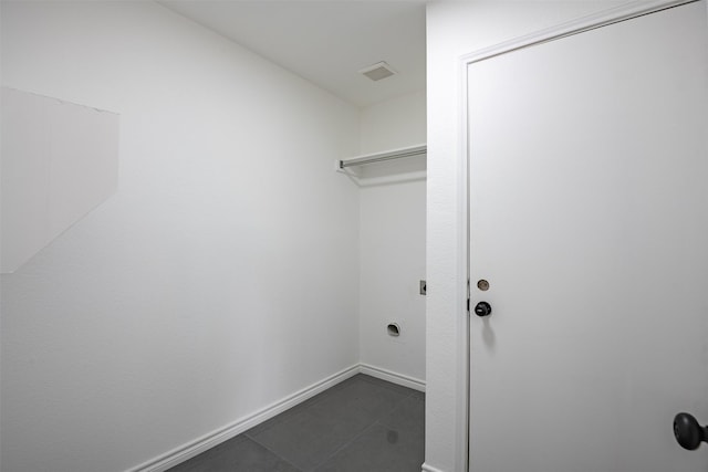 washroom featuring dark tile patterned floors