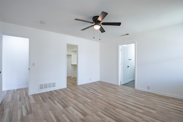 unfurnished room with ceiling fan and light hardwood / wood-style flooring