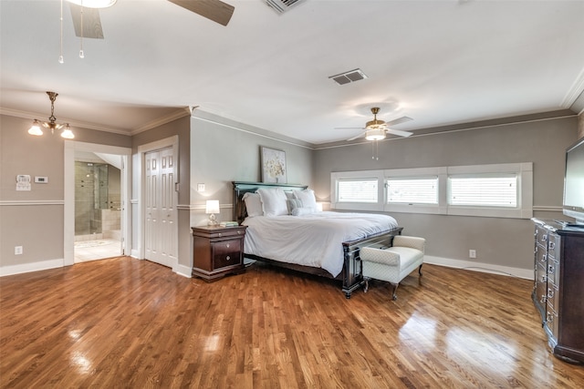 bedroom featuring connected bathroom, ornamental molding, ceiling fan with notable chandelier, and hardwood / wood-style flooring