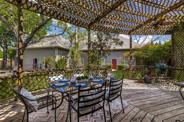 deck featuring a pergola and area for grilling