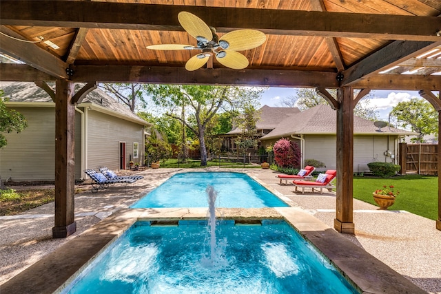 view of swimming pool featuring a gazebo, ceiling fan, a lawn, and a patio area