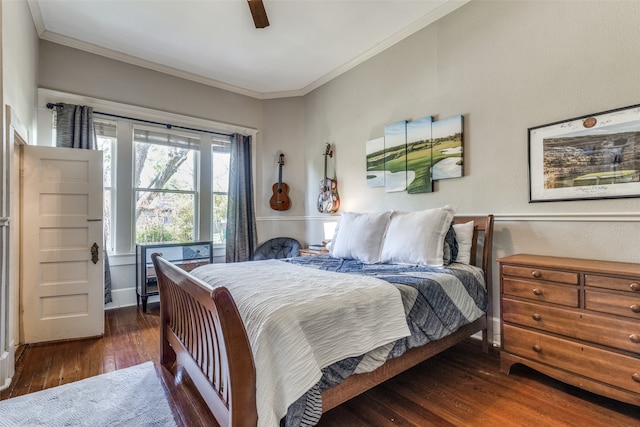 bedroom with crown molding, ceiling fan, and dark hardwood / wood-style floors