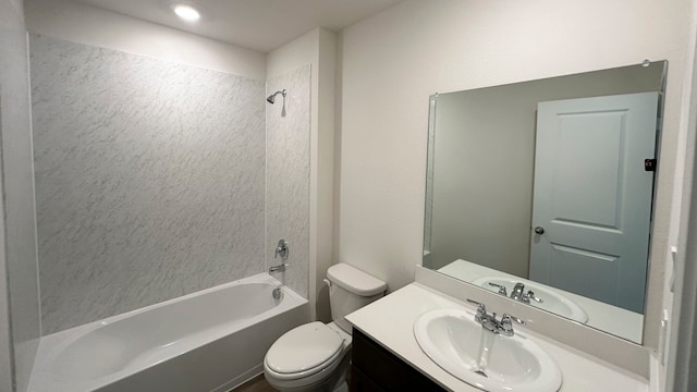 full bathroom featuring toilet, vanity, and bathing tub / shower combination