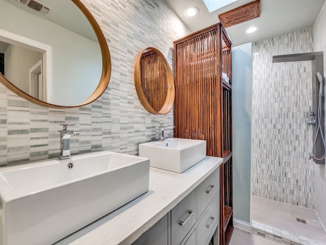 bathroom featuring a tile shower, decorative backsplash, and tile walls