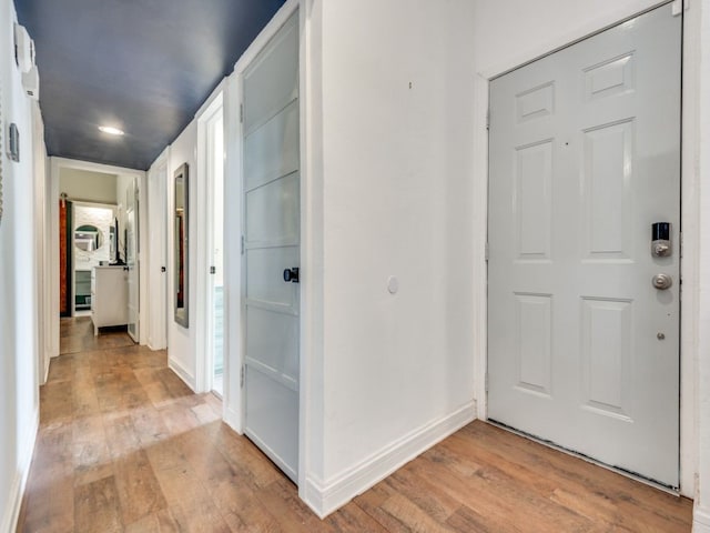 corridor with light wood-type flooring