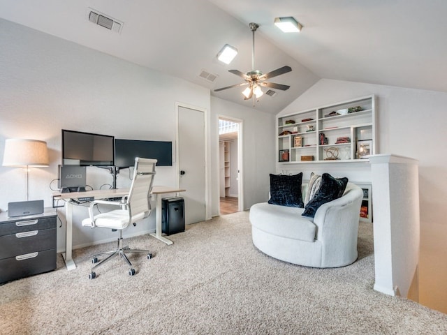 carpeted office featuring vaulted ceiling and ceiling fan