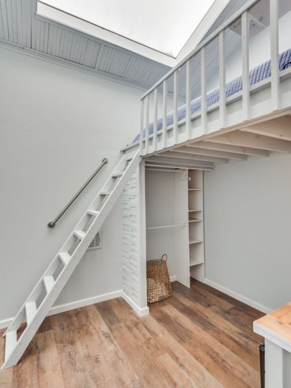 stairway featuring hardwood / wood-style floors