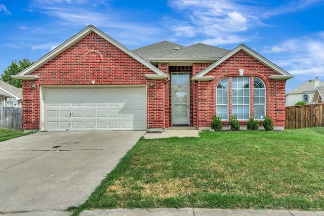 view of front property with a garage and a front yard