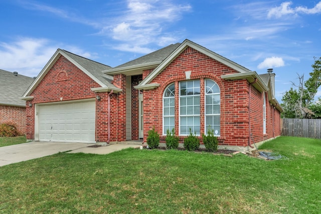 front facade featuring a garage and a front lawn