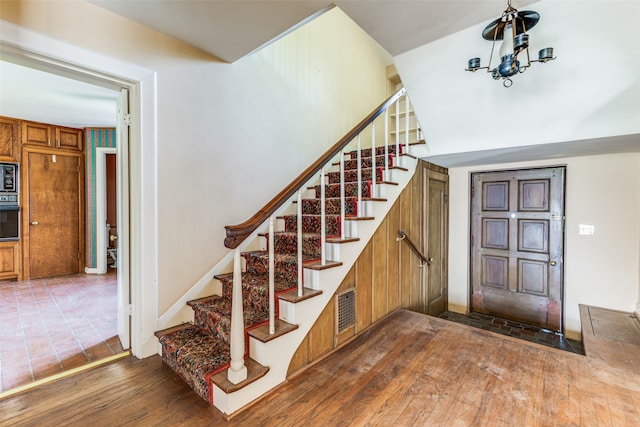 staircase featuring dark hardwood / wood-style floors