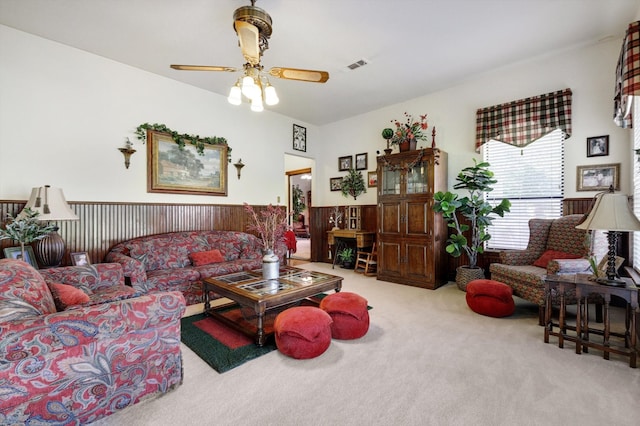 living room with carpet floors and ceiling fan