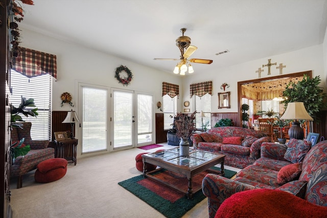 carpeted living room featuring ceiling fan