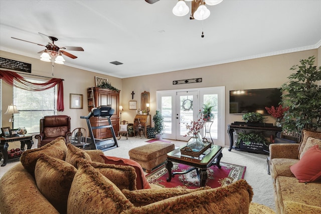 carpeted living room with ceiling fan and crown molding