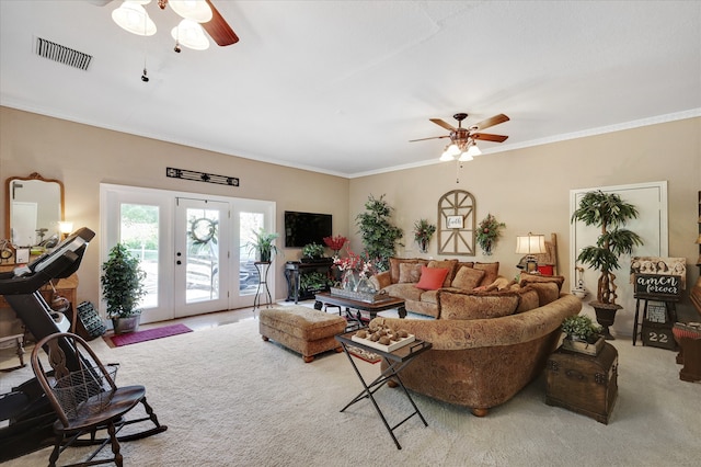 living room with carpet flooring, french doors, crown molding, and ceiling fan