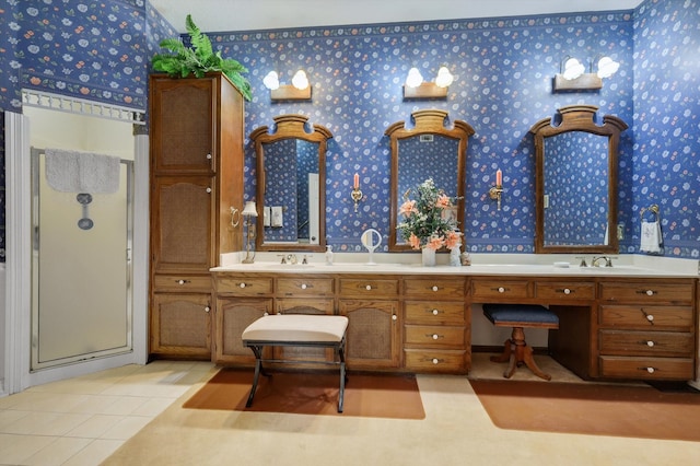 bathroom featuring a shower with door, tile patterned flooring, and double vanity