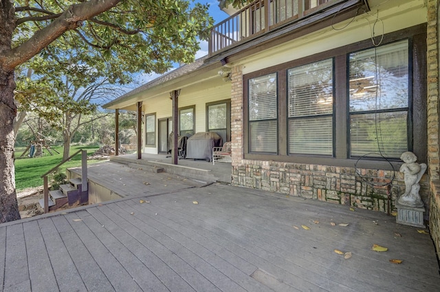 wooden terrace with area for grilling