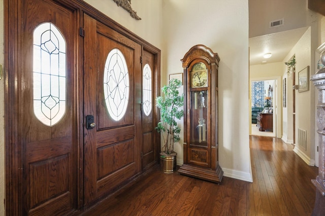 foyer entrance featuring dark hardwood / wood-style flooring