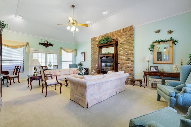 living room with crown molding, a fireplace, carpet, and ceiling fan