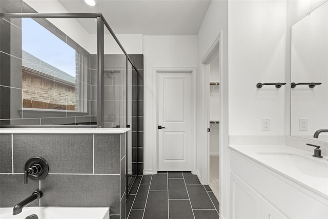 bathroom with vanity, tile patterned floors, and walk in shower