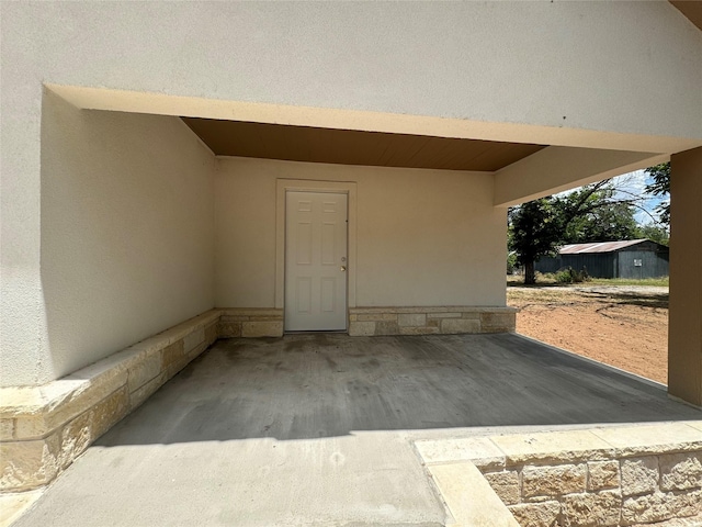 entrance to property with a carport